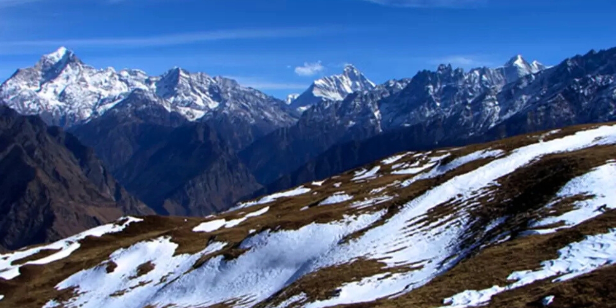Golden sunset over snow capped Himalayan mountains